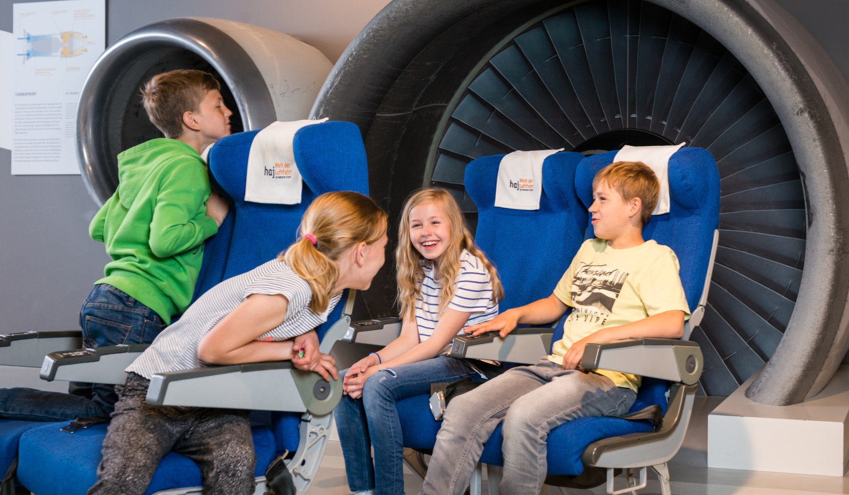 children in front of the turbine, © Hannover Airport / Maasewerd